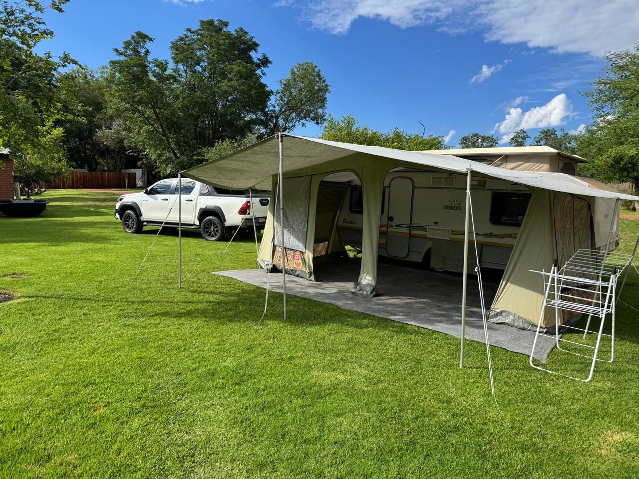 A supplied caravan photograph showing a camping and awning setup